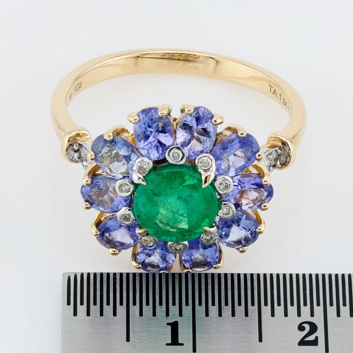 Luxurious 14ct gold (mix) ring with 1.04Ct central natural Emeraldom, accented with 1.94Ct (10 pcs) natural Tanzanitu 
