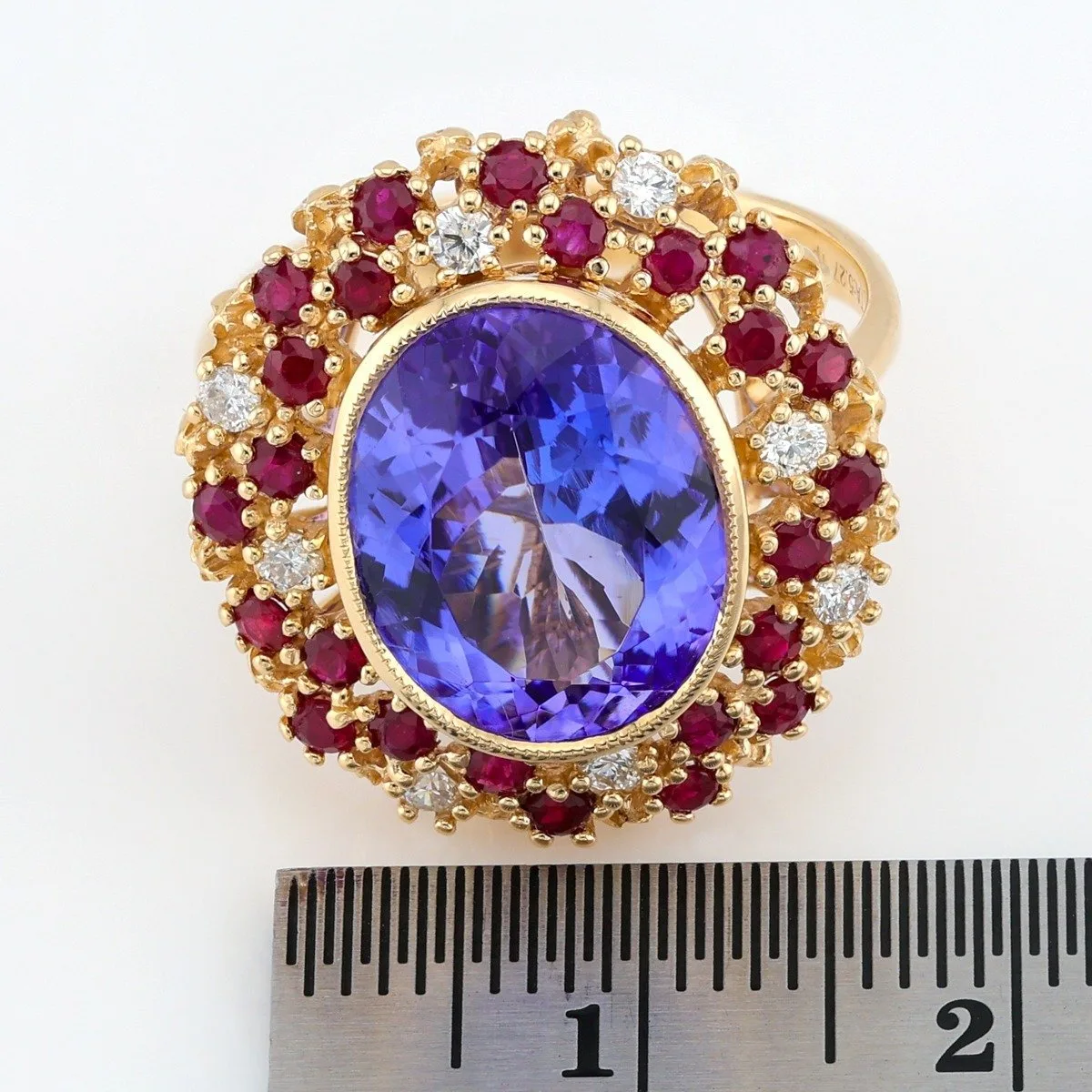 Ring Royal in yellow 14ct gold with large 5.27ct Tanzanite, 24 pcs (0.75ct) Rubies and 8 pcs (0,19ct) diamonds
