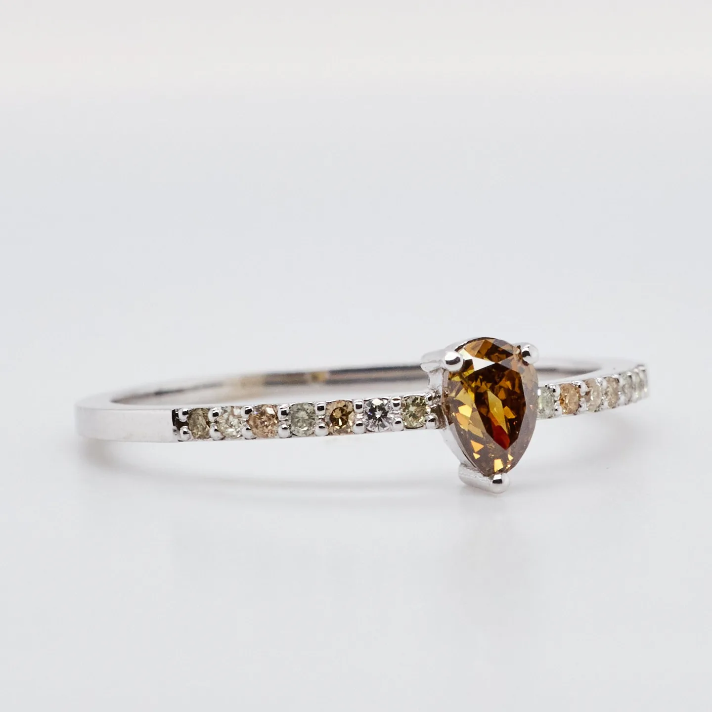 Minimalist ring in white 14ct gold with unconventional Fancy Deep Yellowish Brown diamond and 14 pcs natural diamonds to